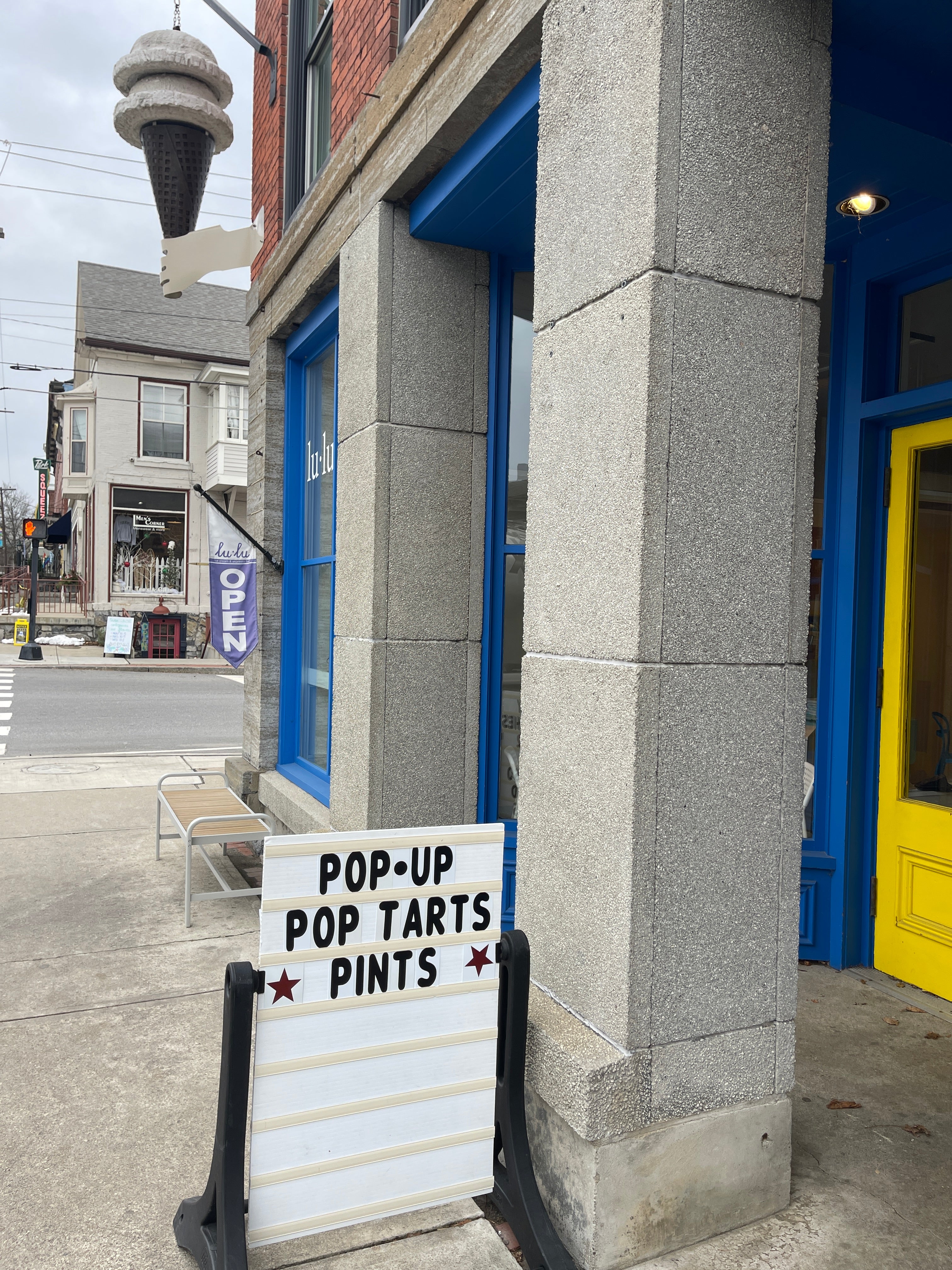 lu lu vergennes shop window and open sign