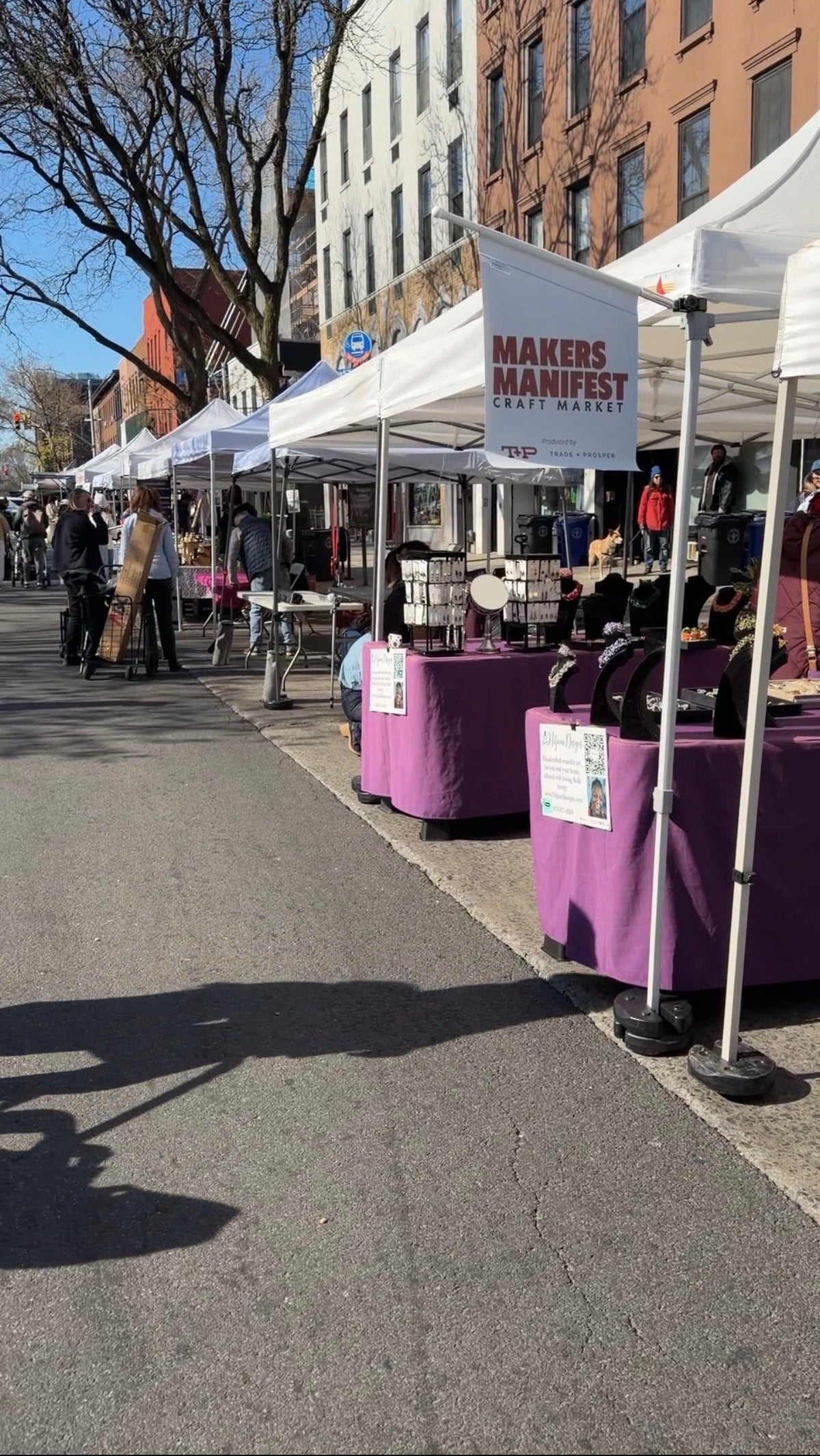 Photo of pop up tents on street with Makers Manifest sign