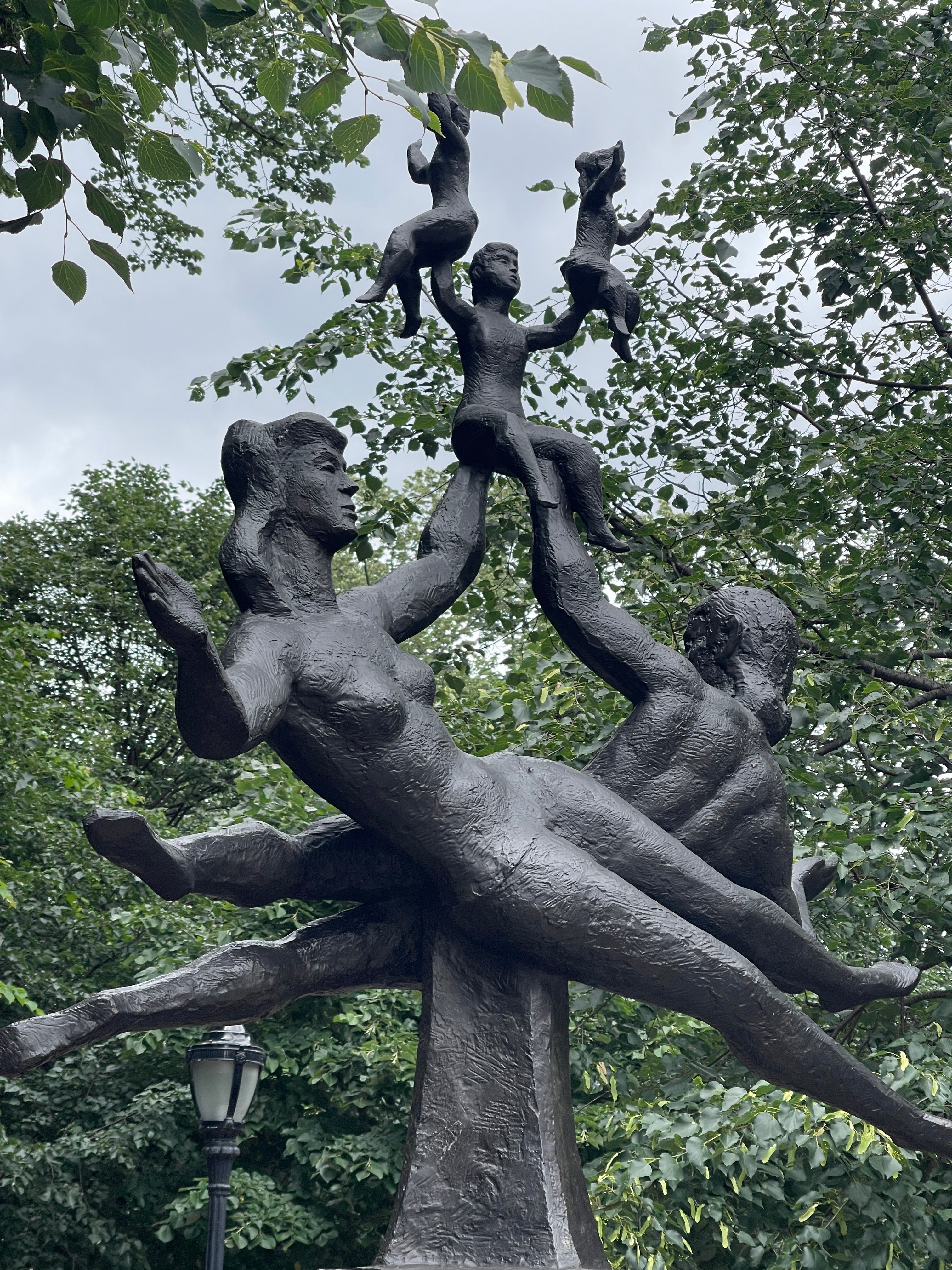 sculpture in Bleeker Park NYC of a family